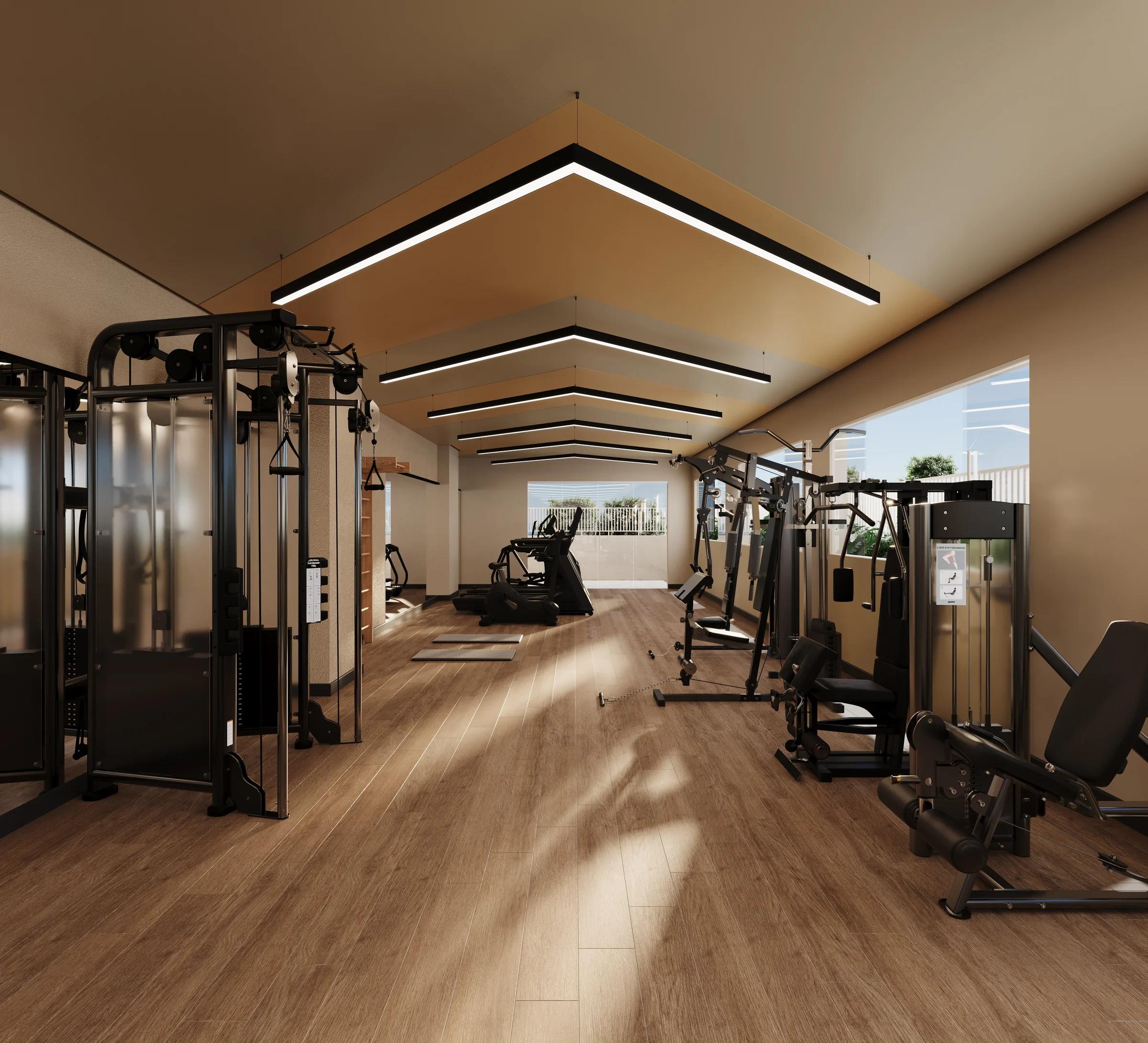 Espaço fitness equipado com aparelhos de musculação e iluminação moderna no teto