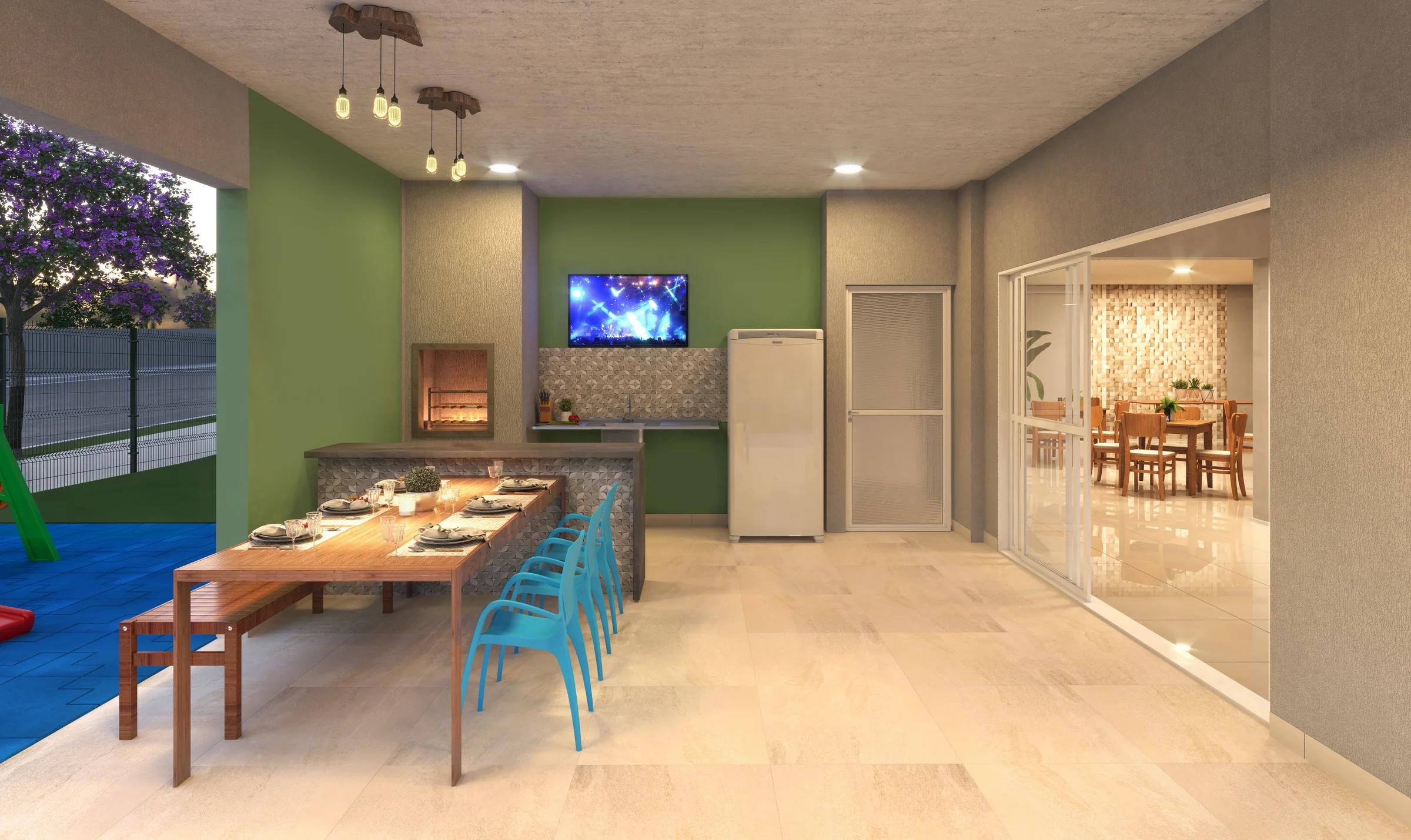 Espaço gourmet com mesa de jantar e bancada com cooktop integrada