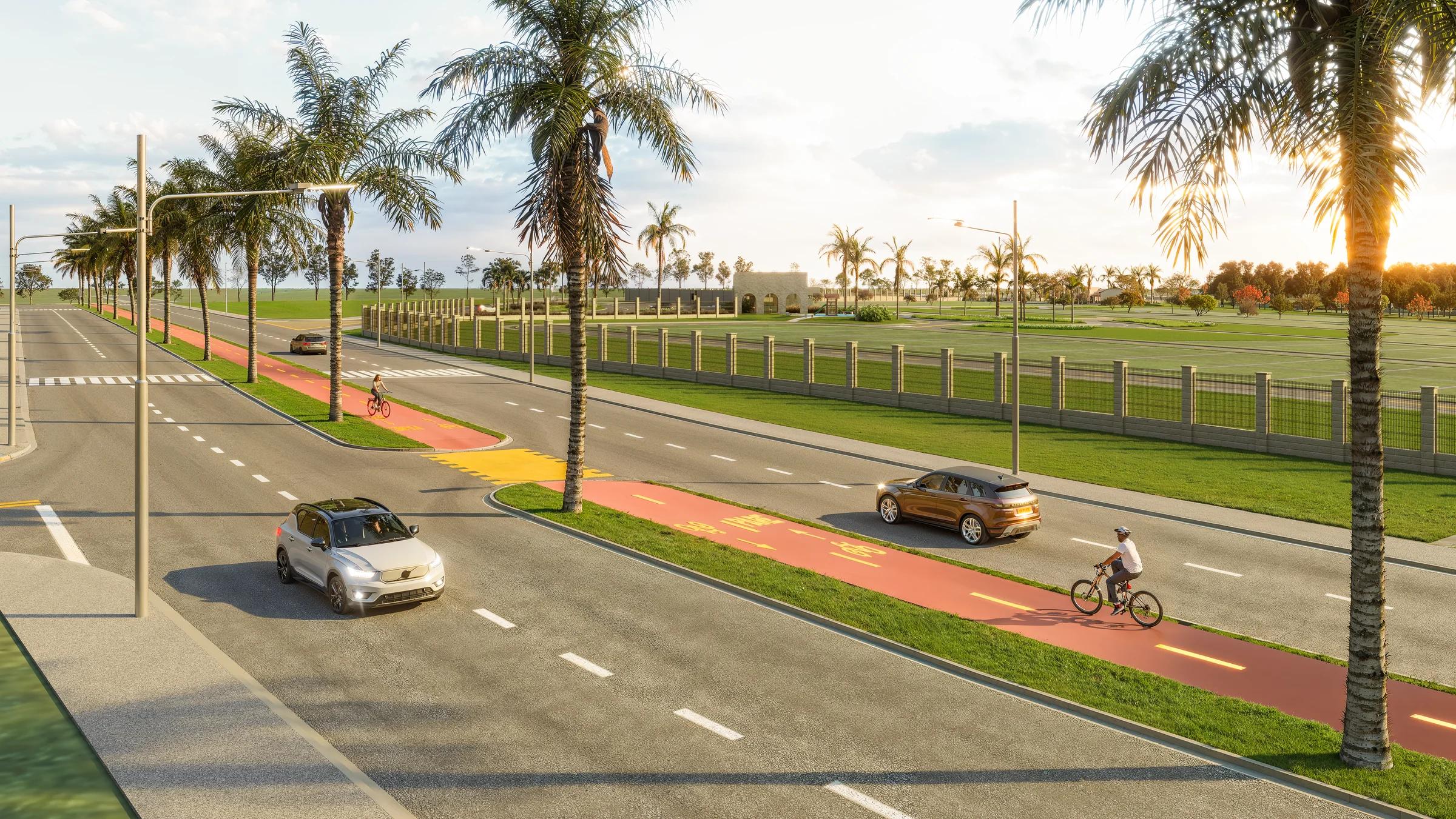 Parque Évora II - Loteamento Aberto - Avenida do loteamento com ciclovia, palmeiras e veículos