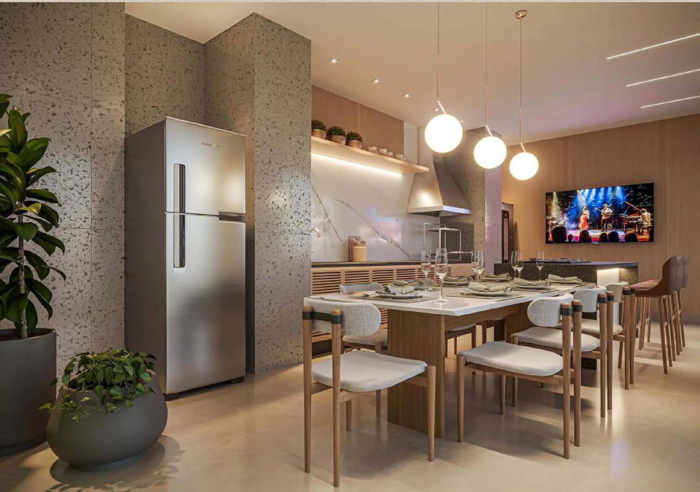 Espaço gourmet com mesa de jantar, bancada de apoio e iluminação pendente