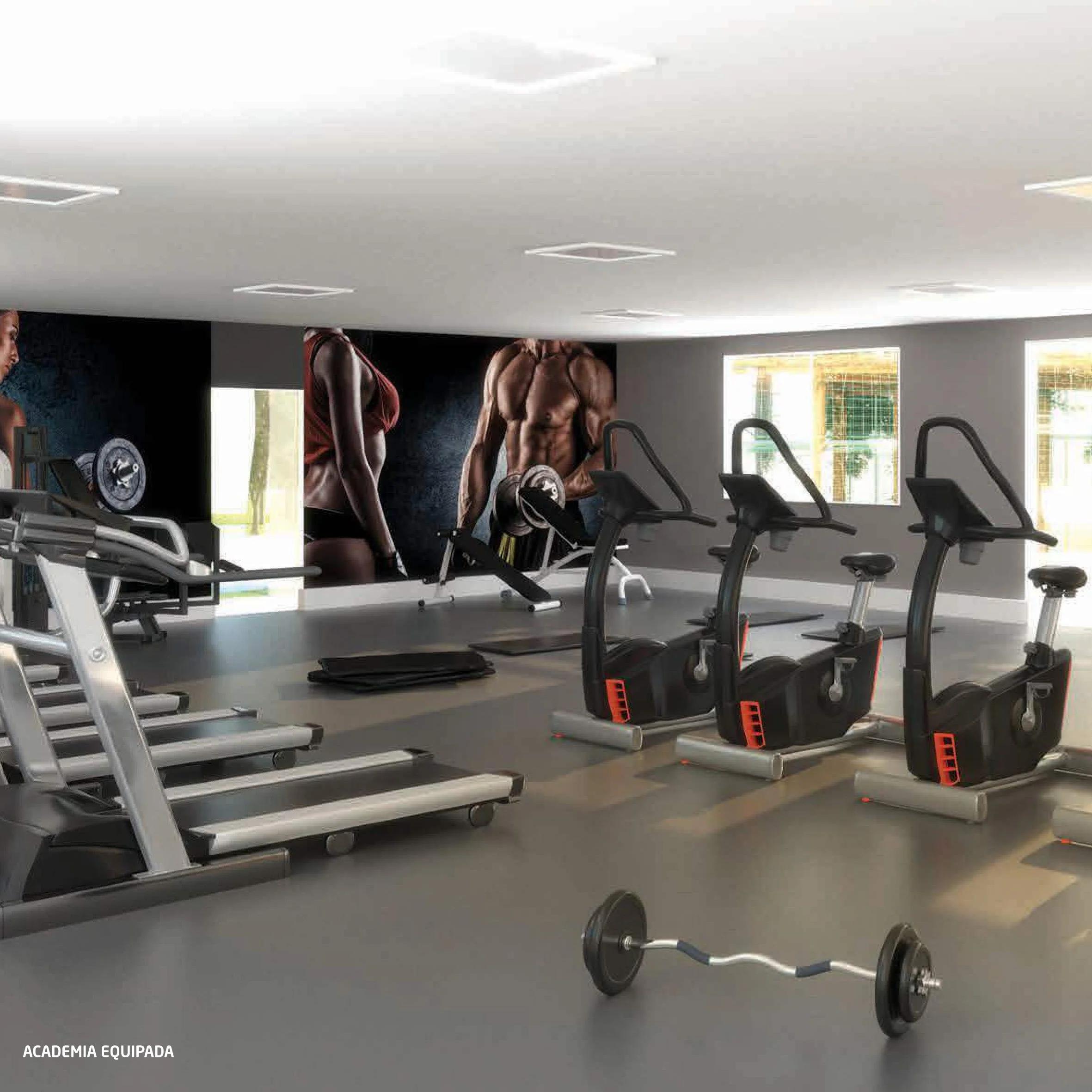 Perspectiva do espaço fitness com esteiras e bicicletas ergométricas
