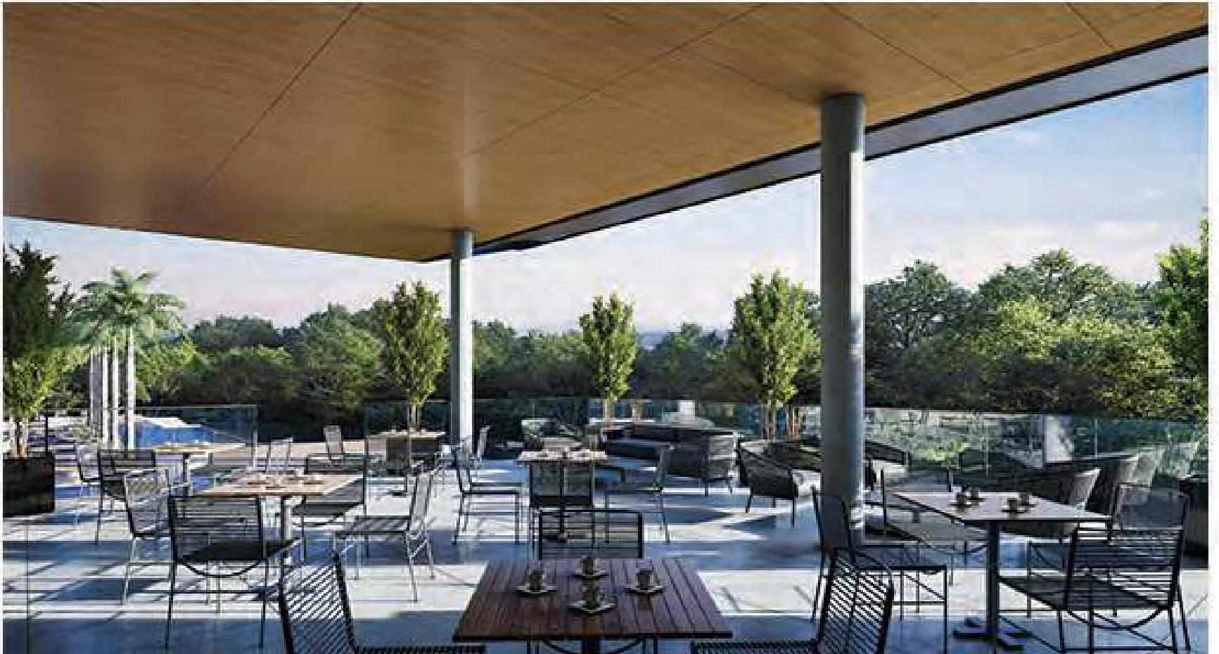 Terraço lounge coberto com mesas e cadeiras voltadas para a vista