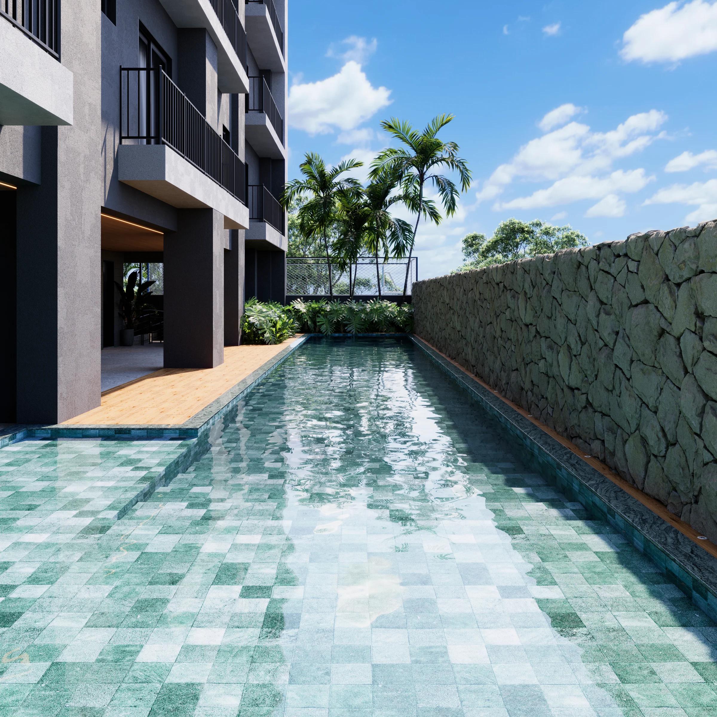 Piscina com raia margeada por deck de madeira e muro de pedra