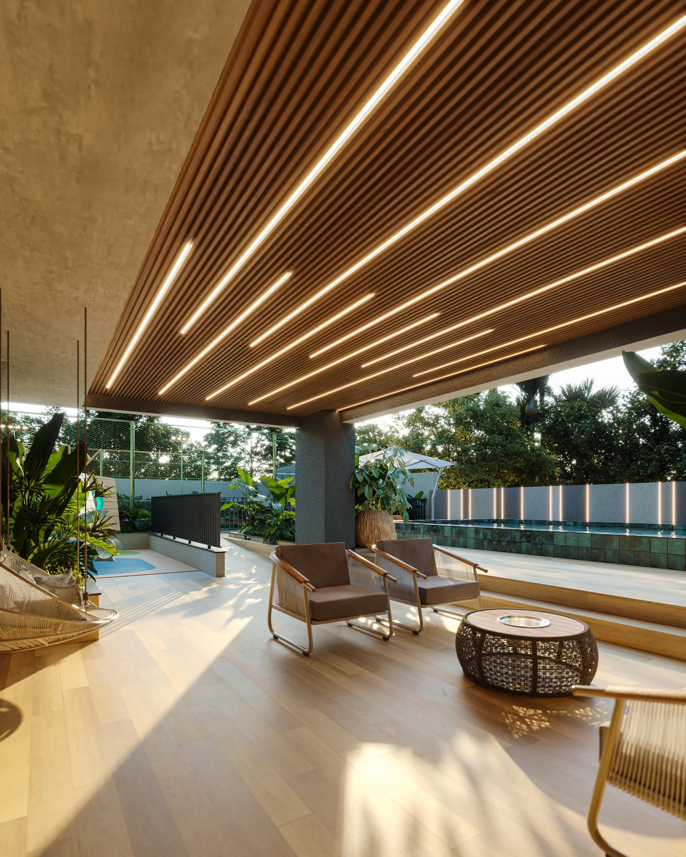 Deck externo coberto com poltronas e lounge ao lado da piscina
