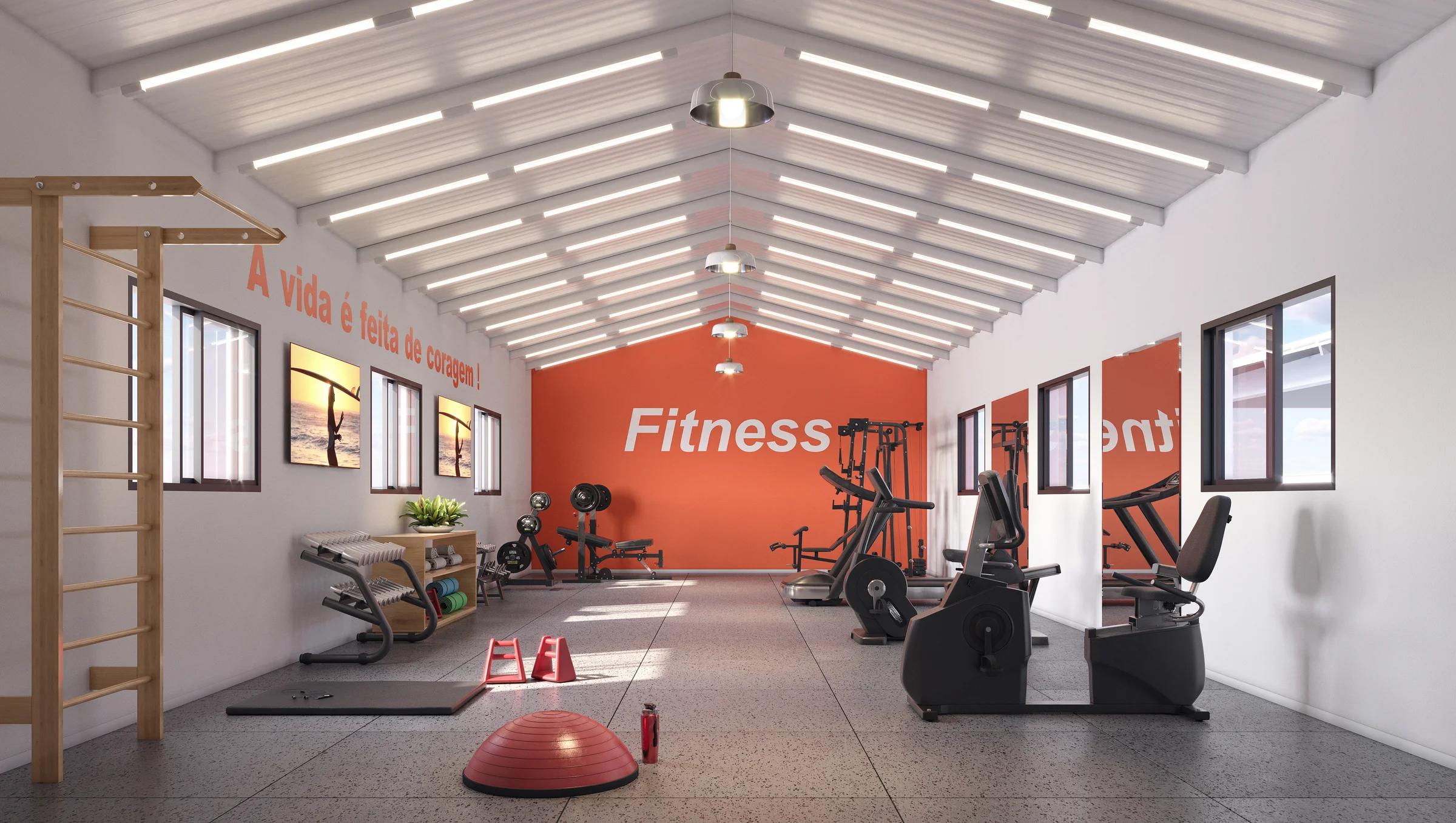 Espaço fitness equipado com esteiras, bicicletas ergométricas e aparelhos de musculação.