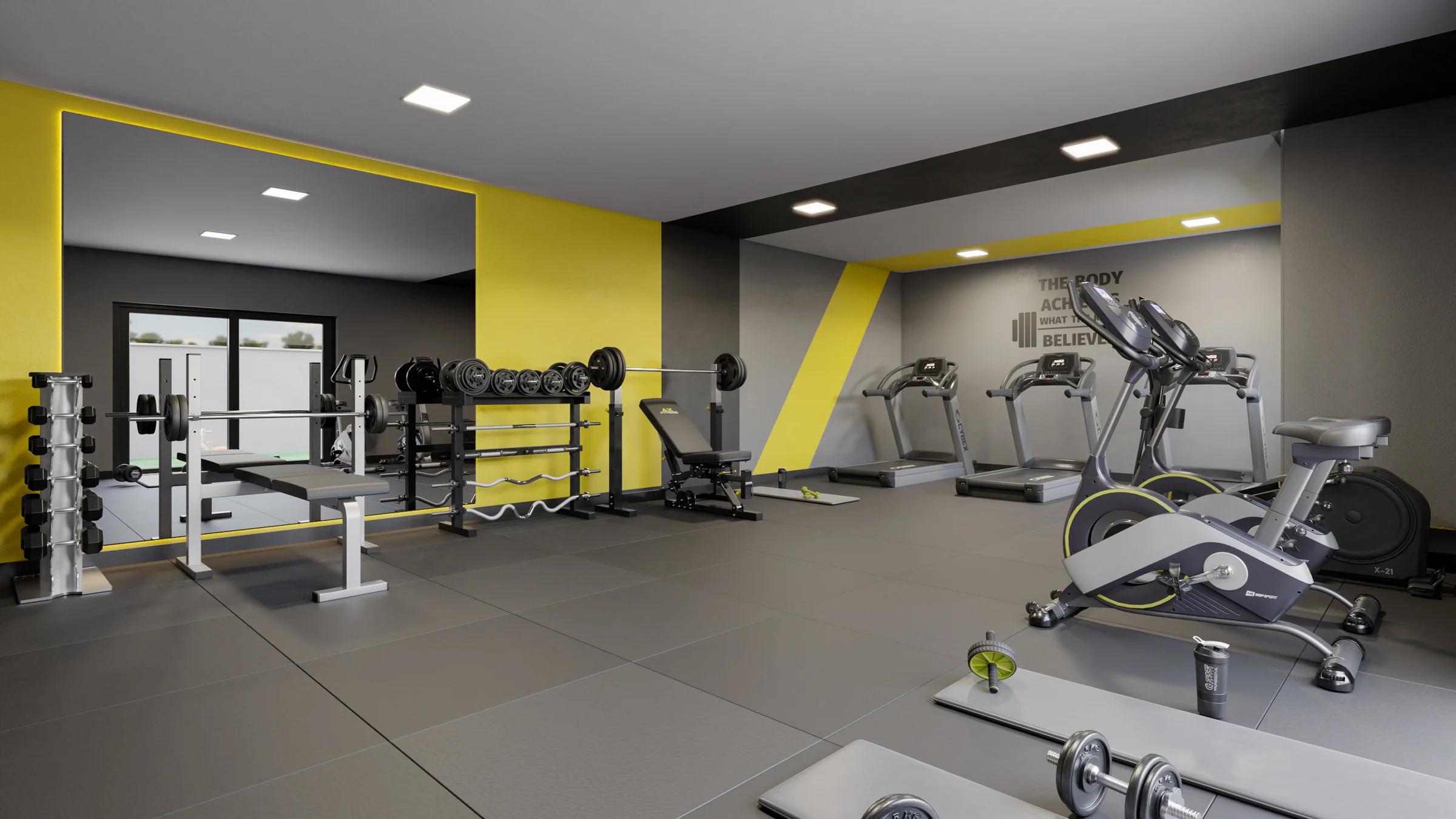 Academia equipada com esteiras, bicicletas ergométricas e suporte de halteres