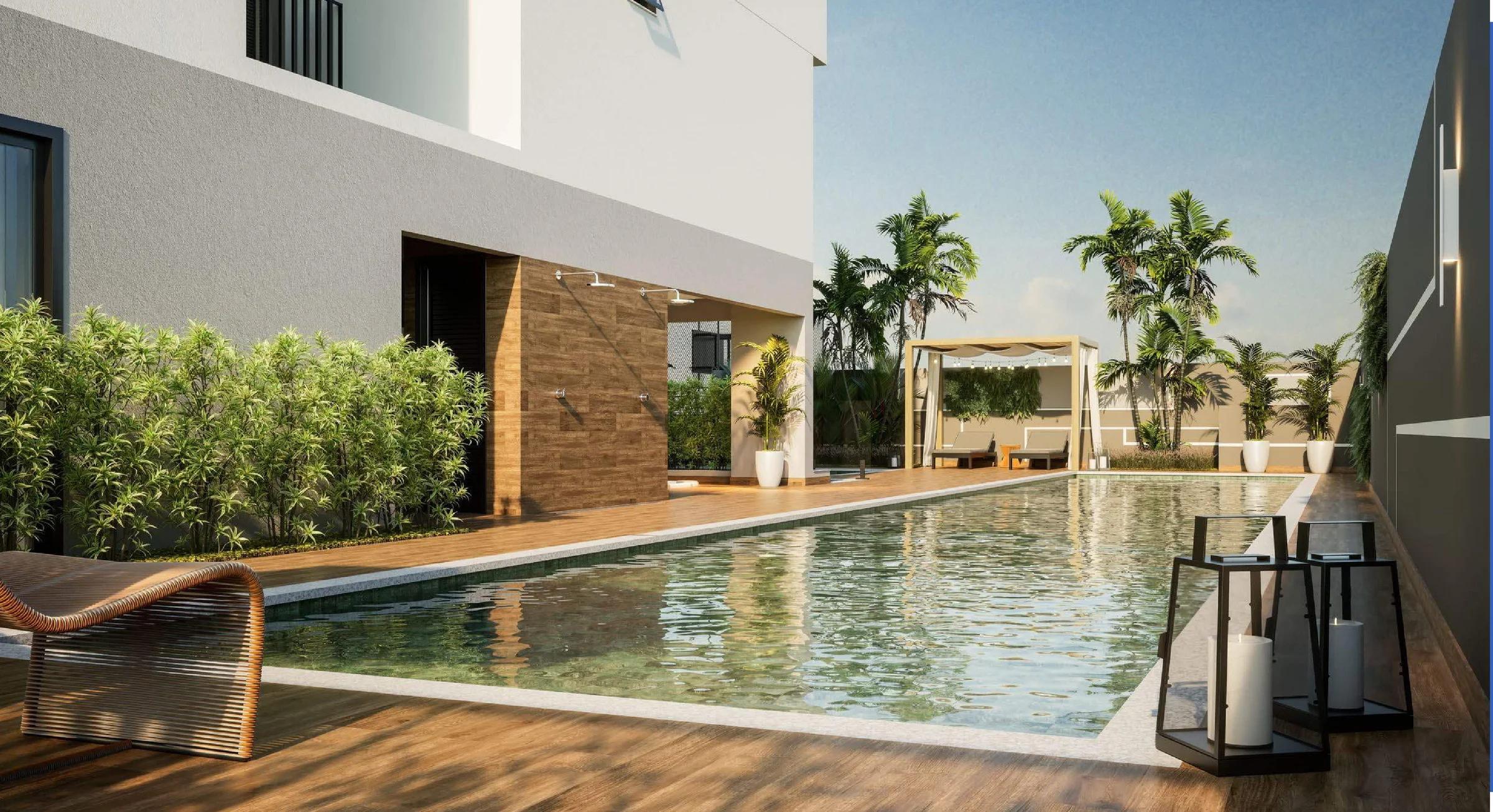 Piscina com raia, deck de madeira, bangalô e paisagismo