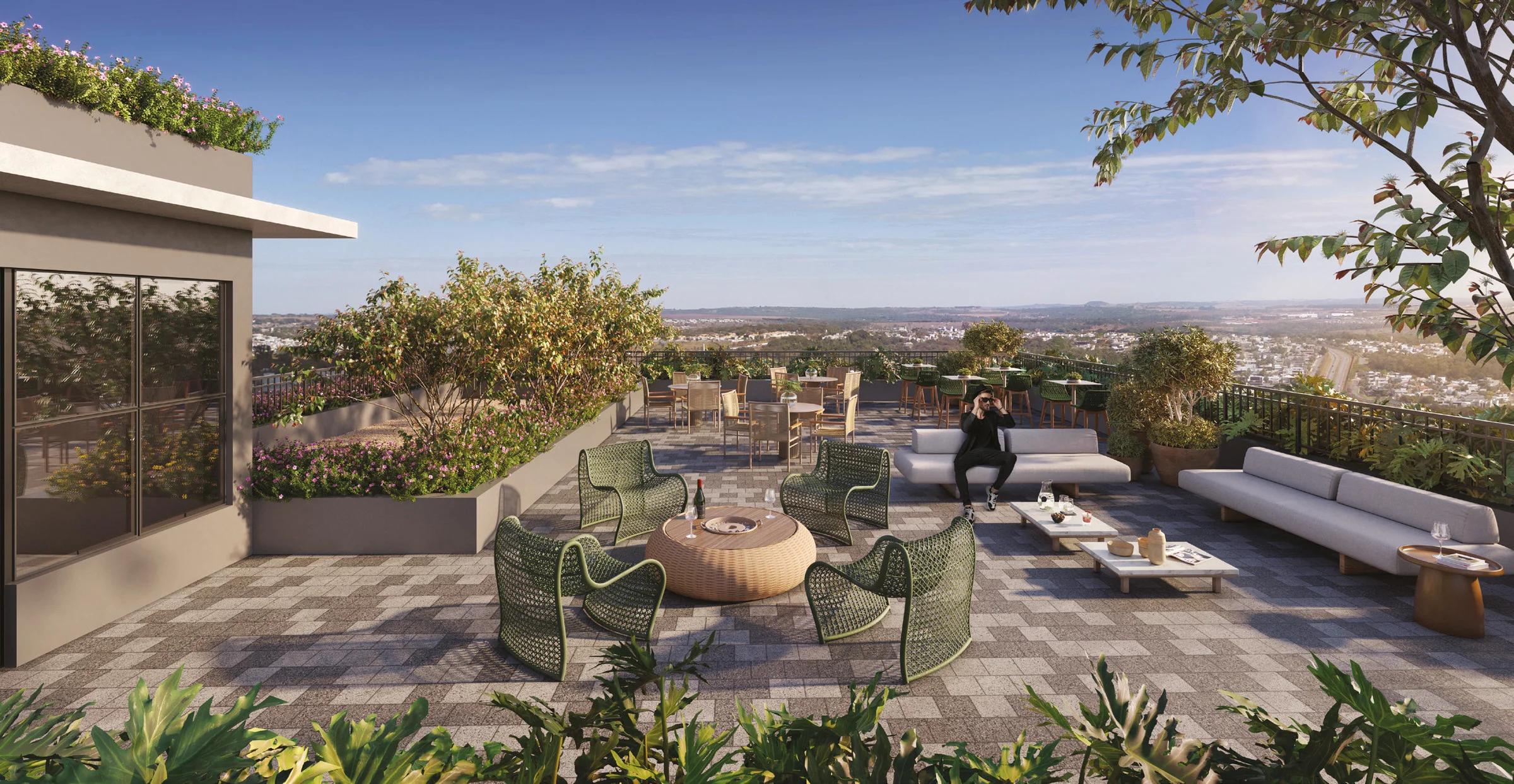 Perspectiva de terraço com assentos, vegetação e vista do entorno.