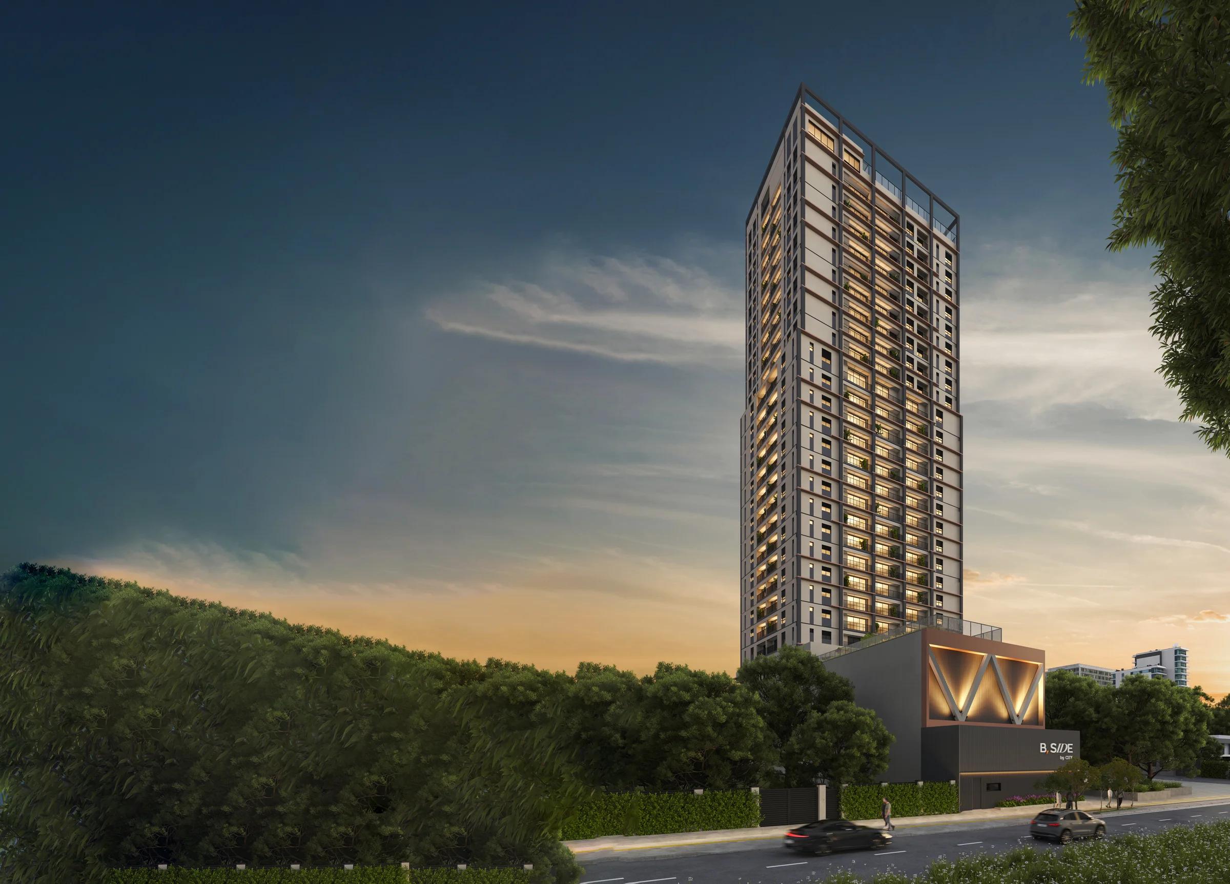 Vista ampla da torre residencial e seu entorno arborizado na rua