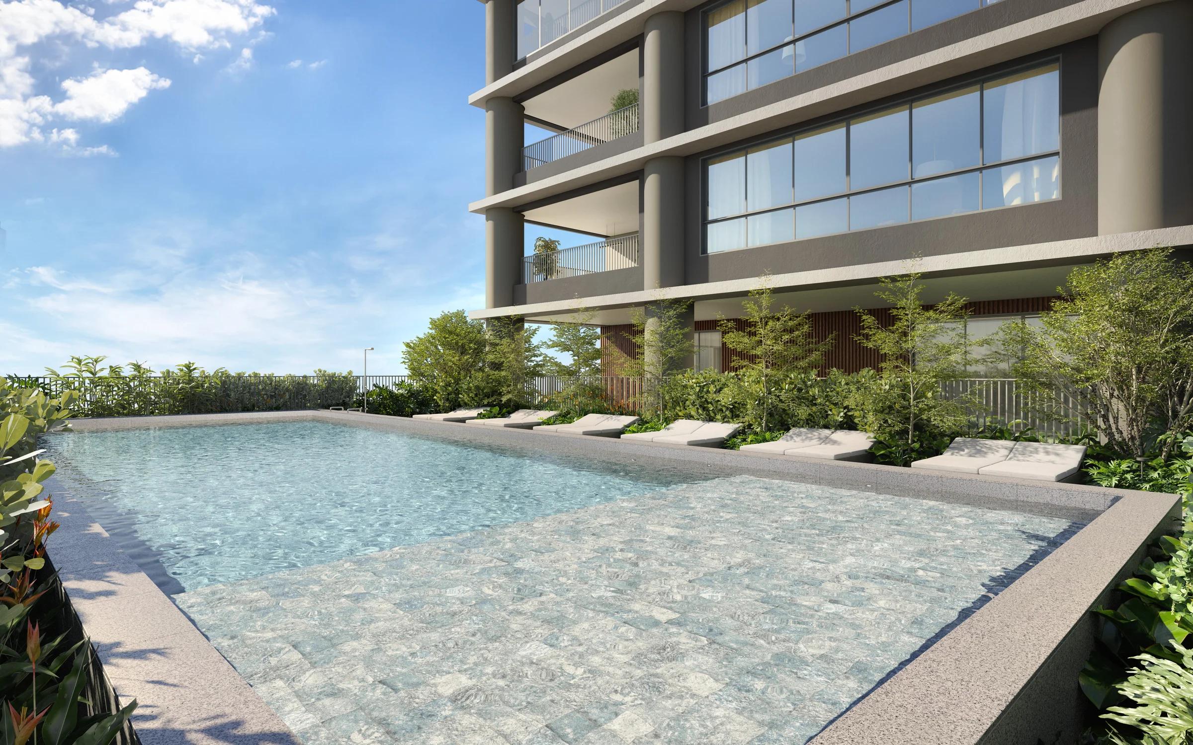 Piscina ao ar livre com prainha, espreguiçadeiras e jardim lateral
