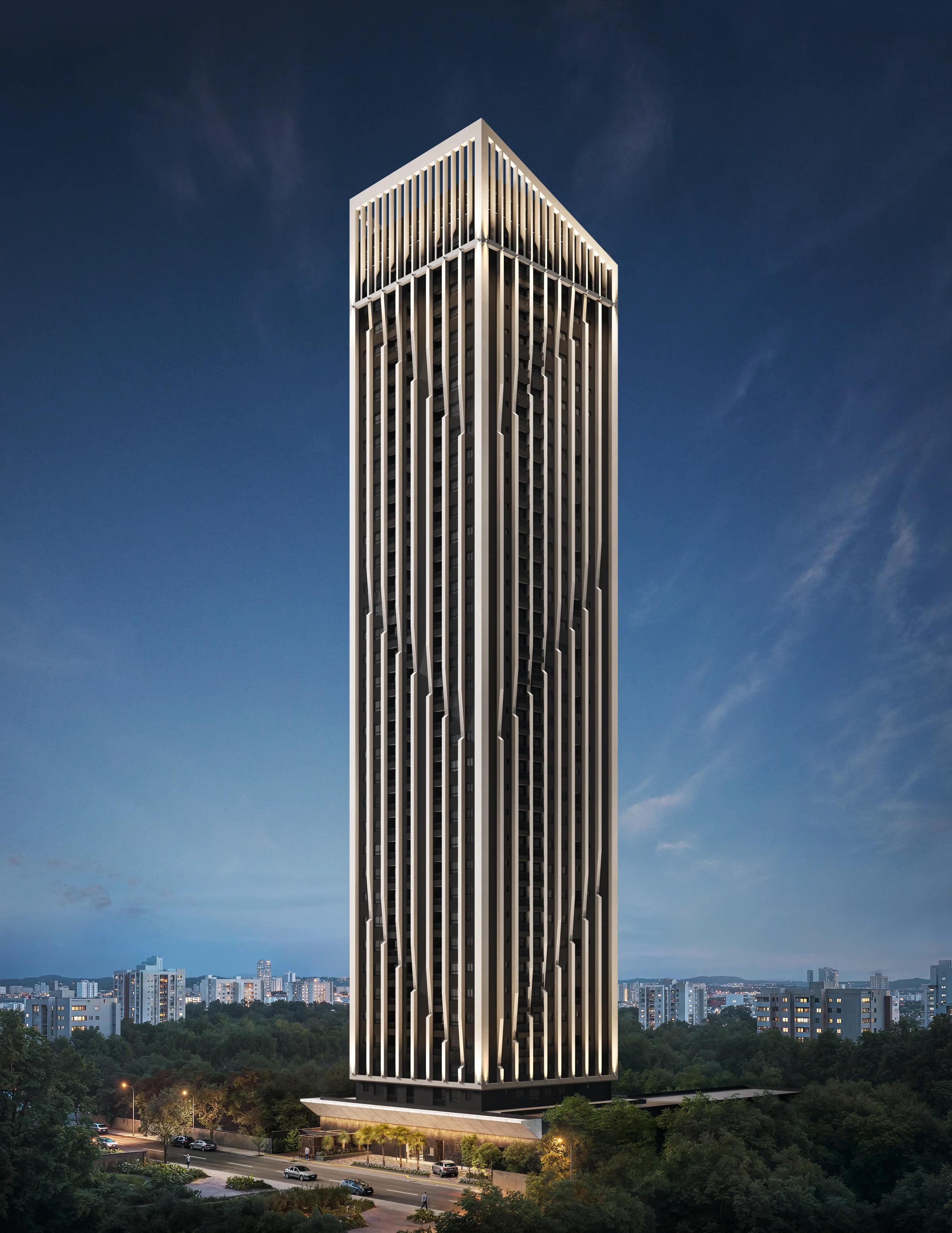 Fachada frontal completa da torre à noite com iluminação arquitetônica destacada