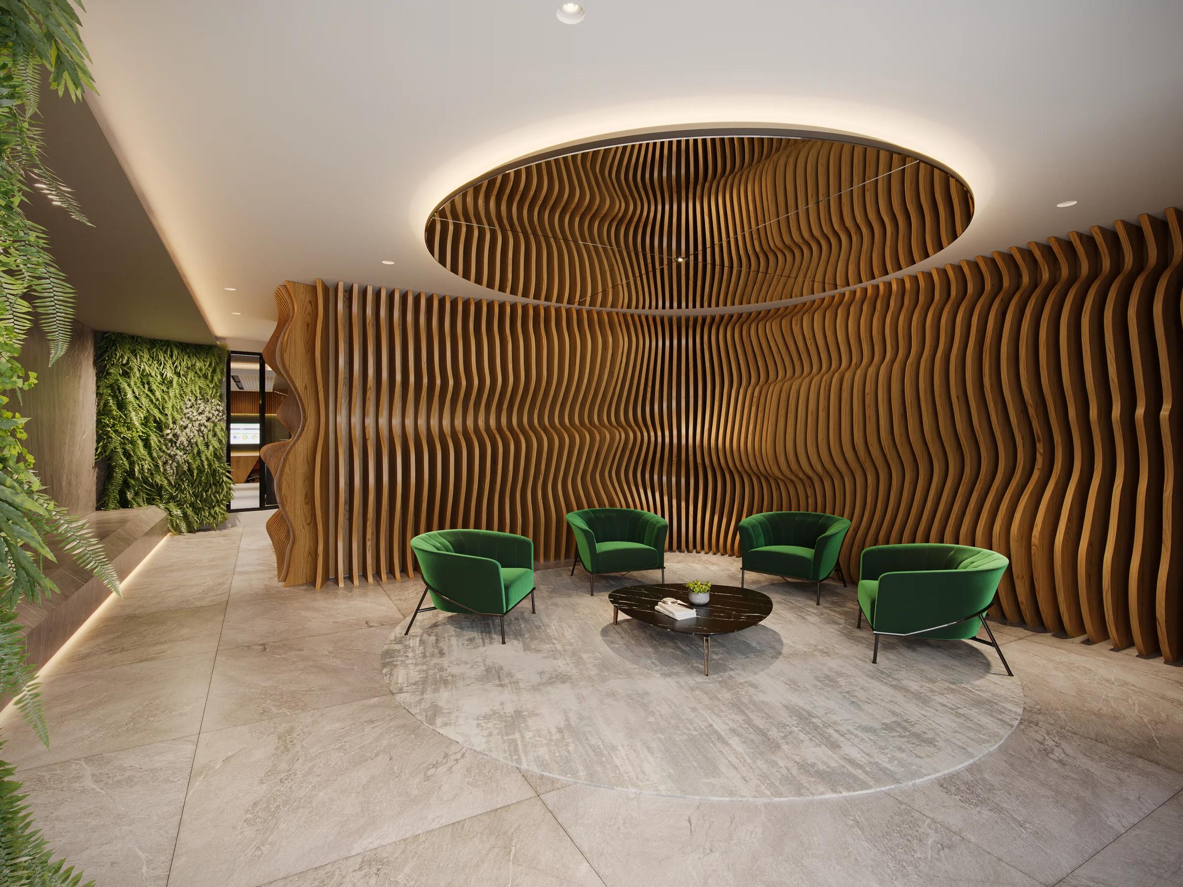 Lobby do edifício com painel ondulado de madeira ripada e poltronas verdes sobre tapete redondo