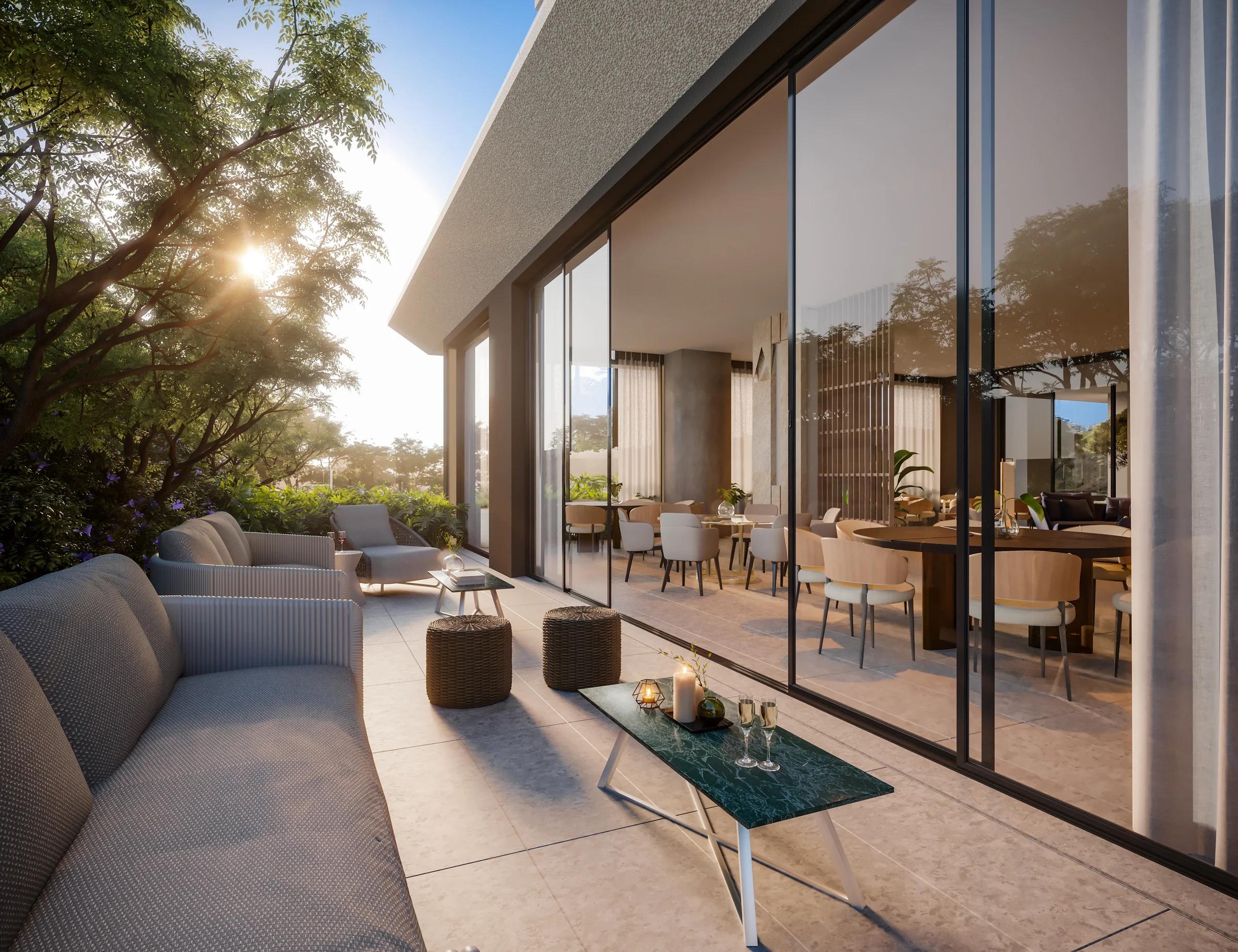 Lounge externo com sofás integrado à área de festas e jardim