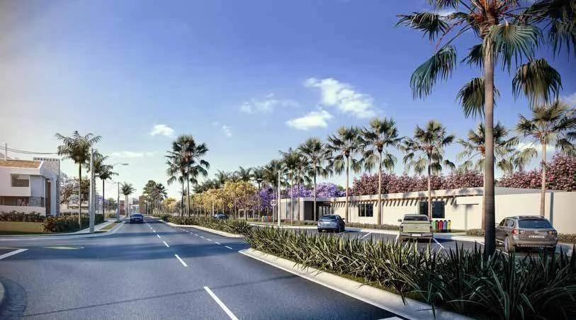 Avenida arborizada com acesso e portaria