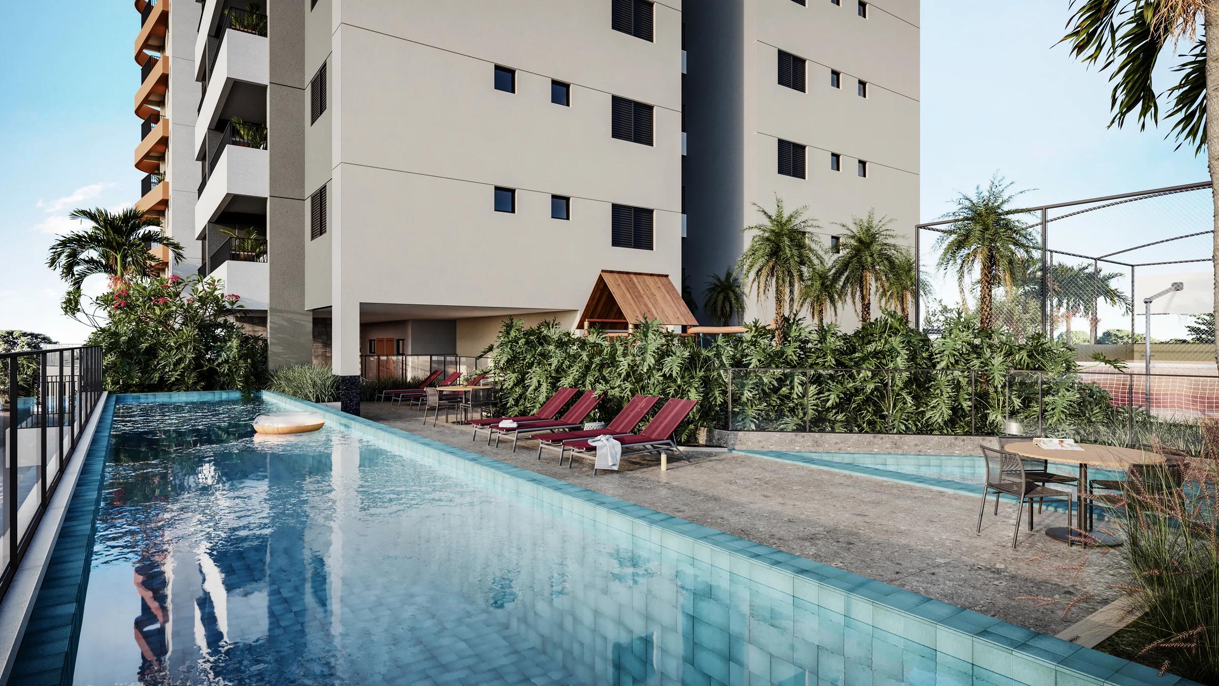 Piscina adulto com raia, deck com espreguiçadeiras e jardim lateral
