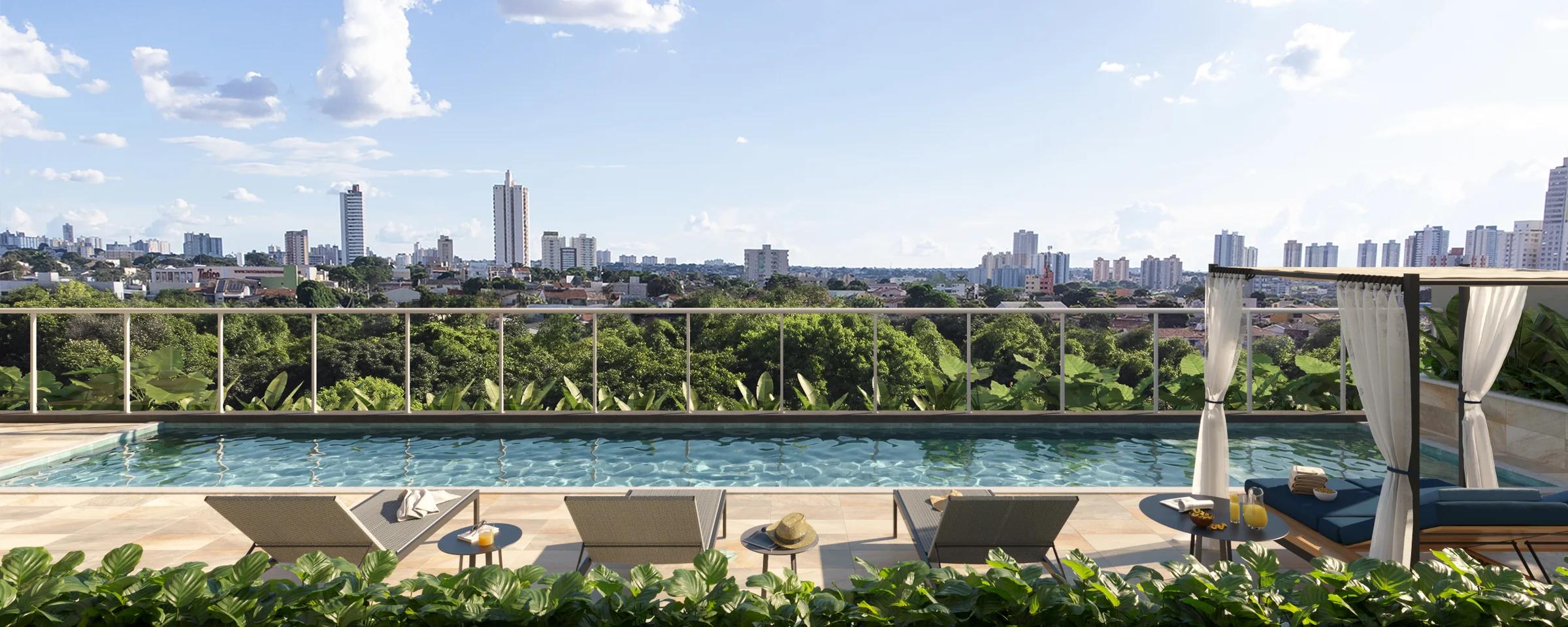 Piscina adulto com espreguiçadeiras, gazebo e vista panorâmica para a cidade