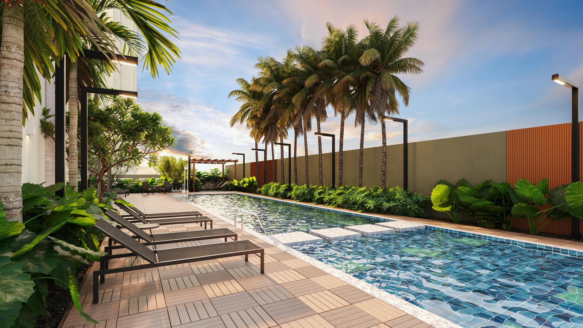 Piscina externa com raia, deck com espreguiçadeiras e paisagismo com palmeiras.