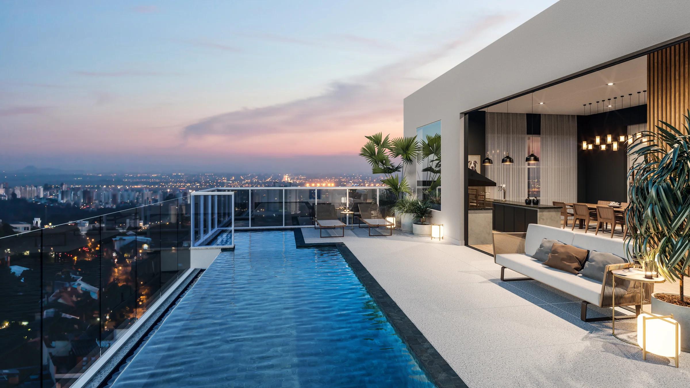Perspectiva do deck e da piscina com vista da cidade.