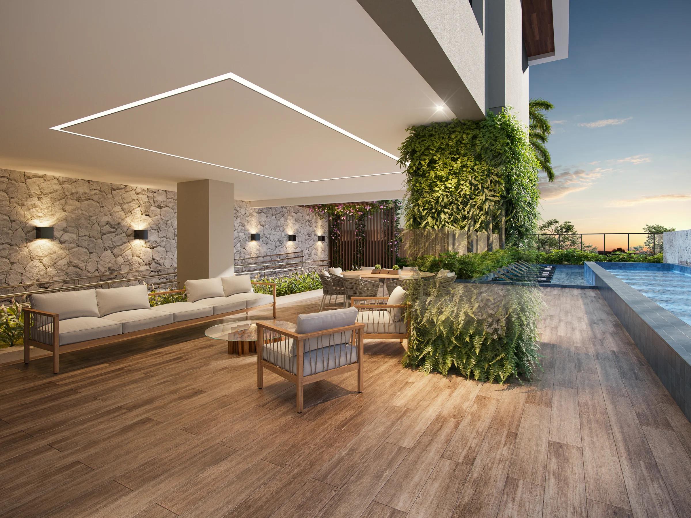 Varanda coberta com lounge de estar, jardim vertical e deck de madeira integrado à piscina.
