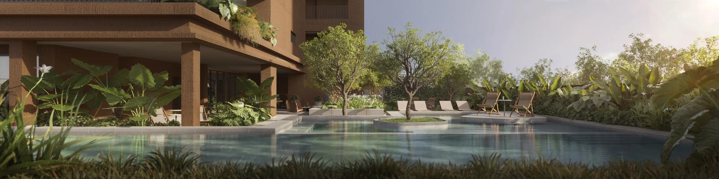 Piscina externa cercada por paisagismo denso e espreguiçadeiras